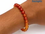 wearing a natural yamini hakik bracelet on wrist