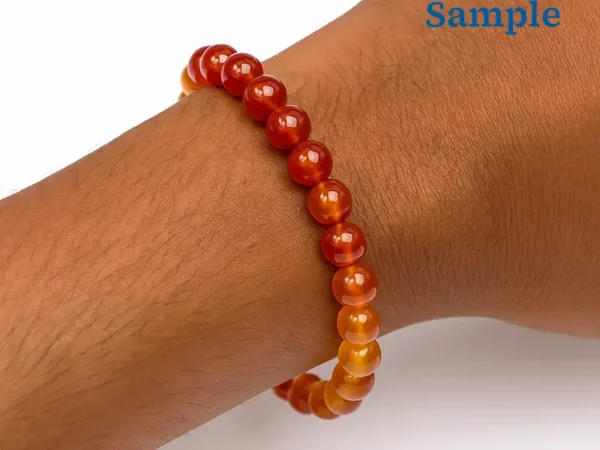 wearing a natural yamini hakik bracelet on wrist