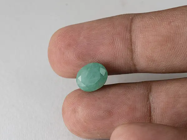 Brazilian Emerald 3.9 Carat (4.29 Ratti) Panna Stone — Sapota 4 Brazilian Emerald 3.9 Carat (4.29 Ratti) Panna Stone in hand — Sapota, true scale and color