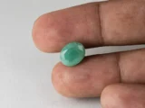 Brazilian Emerald 4.1 Carat (4.51 Ratti) Panna Stone in hand — Sapota, true scale and color