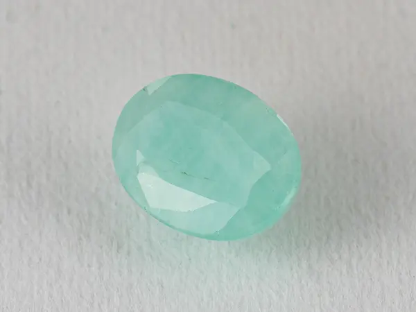 Brazilian Emerald 4.65 Carat (5.11 Ratti) Panna Stone — Sapota 1 Brazilian Emerald 4.65 Carat (5.11 Ratti) Panna Stone top view — Sapota, vivid green oval