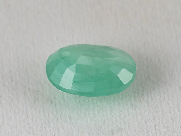 Brazilian Emerald 4.85 Carat (5.33 Ratti) Panna Stone - Sapota 3 Brazilian Emerald 4.85 Carat (5.33 Ratti) Panna Stone - Sapota back view with pavilion facets and symmetry