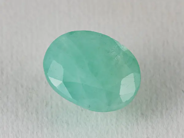 Brazilian Emerald 5.1 Carat (5.60 Ratti) Panna Stone — Sapota 1 Brazilian Emerald 5.1 Carat (5.60 Ratti) Panna Stone top view — Sapota, vivid green oval