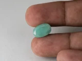 Brazilian Emerald 5.6 Carat (6.15 Ratti) Panna Stone in hand — Sapota, true scale and color