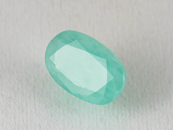 Brazilian Emerald 5.6 Carat (6.15 Ratti) Panna Stone — Sapota 1 Brazilian Emerald 5.6 Carat (6.15 Ratti) Panna Stone top view — Sapota, vivid green oval