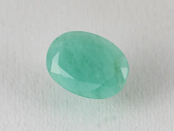 Brazilian Emerald 5.8 Carat (6.37 Ratti) Panna Stone — Sapota 1 Brazilian Emerald 5.8 Carat (6.37 Ratti) Panna Stone top view — Sapota, vivid green oval