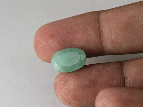 Brazilian Emerald 6.2 Carat (6.81 Ratti) Panna Stone — Sapota 3 Brazilian Emerald 6.2 Carat (6.81 Ratti) Panna Stone in hand — Sapota, true scale and color