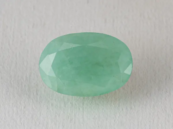 Brazilian Emerald 6.2 Carat (6.81 Ratti) Panna Stone — Sapota 1 Brazilian Emerald 6.2 Carat (6.81 Ratti) Panna Stone top view — Sapota, vivid green oval
