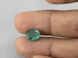 3.35 carat emerald in hand 10.8×8.9×5.4 mm