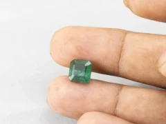 3.85 carat emerald in hand 9.2×9×5.7 mm