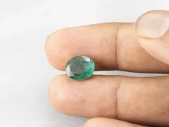 3.95 carat emerald in hand 11.5×9.4×4.9 mm