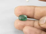 4.33 carat emerald in hand 12.4×8.6×5.4 mm