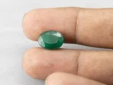 6.11 carat emerald in hand 13.5×10×6.1 mm