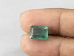 6.73 carat emerald in hand 13.3×9.5×6.3 mm
