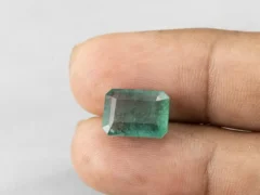 6.73 carat emerald in hand 13.3×9.5×6.3 mm