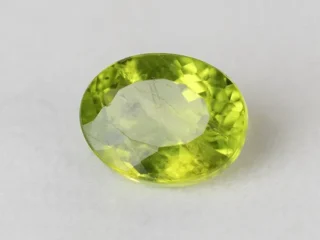 Peridot Stone 5.2 Carat (5.71 Ratti) overhead in natural green Oval Mix Cut