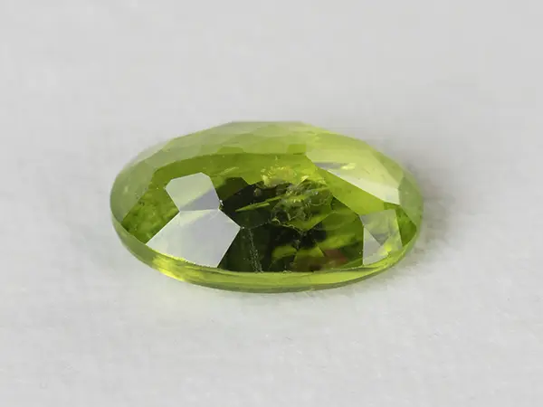Peridot Stone 5.94 Carat (6.53 Ratti) 3 Peridot Stone 5.94 Carat (6.53 Ratti) back view with pavilion facets and symmetry