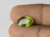 Peridot Stone 5.94 Carat (6.53 Ratti) in hand for real-life scale and color