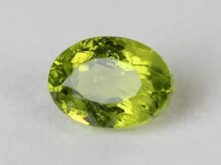 Peridot Stone 6.55 Carat (7.20 Ratti) top view in natural green Oval Mix Cut