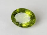 Peridot Stone 6.57 Carat (7.22 Ratti) top view in natural green Oval Mix Cut