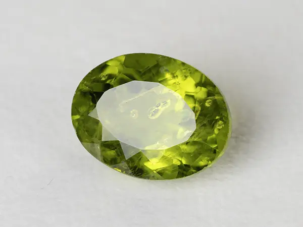 Peridot Stone 6.57 Carat (7.22 Ratti) 1 Peridot Stone 6.57 Carat (7.22 Ratti) top view in natural green Oval Mix Cut