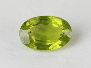 Peridot Stone 6.63 Carat (7.29 Ratti) overhead in natural green Oval Mix Cut
