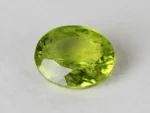 Peridot Stone 7.02 Carat (7.71 Ratti) top view in natural green Oval Mix Cut