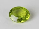 Peridot Stone 7.02 Carat (7.71 Ratti) top view in natural green Oval Mix Cut