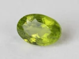 Peridot Stone 7.06 Carat (7.76 Ratti) overhead in natural green Oval Mix Cut