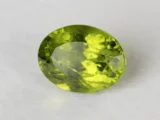 Peridot Stone 7.21 Carat (7.92 Ratti) top view in natural green Oval Mix Cut