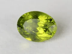 Peridot Stone 7.21 Carat (7.92 Ratti) top view in natural green Oval Mix Cut