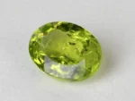 Peridot Stone 7.35 Carat (8.08 Ratti) top view in natural green Oval Mix Cut