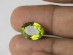 Peridot Stone 7.35 Carat (8.08 Ratti) in hand for real size and color view