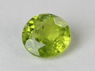Peridot Stone 7.59 Carat (8.34 Ratti) overhead in natural green Round Mix Cut