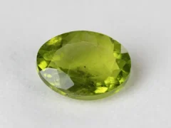 Peridot Stone 7.6 Carat (8.35 Ratti) overhead in natural green Oval Mix Cut