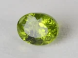 Peridot Stone 7.78 Carat (8.55 Ratti) top view in natural green Oval Mix Cut
