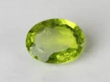 Peridot Stone 8.07 Carat (8.87 Ratti) top view in natural green Oval Mix Cut