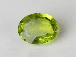 Peridot Stone 8.07 Carat (8.87 Ratti) top view in natural green Oval Mix Cut