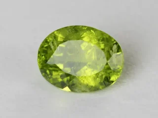 Peridot Stone 8.24 Carat (9.05 Ratti) top view in natural green Oval Mix Cut