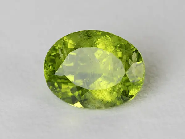 Peridot Stone 8.24 Carat (9.05 Ratti) 1 Peridot Stone 8.24 Carat (9.05 Ratti) top view in natural green Oval Mix Cut