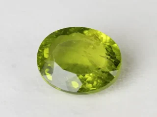 Peridot Stone 9.26 Carat (10.18 Ratti) top view, natural green Oval Mix Cut, ready for ring or pendant