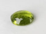 Peridot Stone 9.26 Carat (10.18 Ratti) back view, pavilion facets and symmetry visible