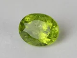 Peridot Stone 9.27 Carat (10.19 Ratti) overhead in natural green Oval Mix Cut