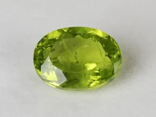 Peridot Stone 9.28 Carat (10.20 Ratti) top view in natural green Oval Mix Cut