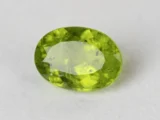 Peridot Stone 9.35 Carat (10.27 Ratti) overhead in natural green Oval Mix Cut