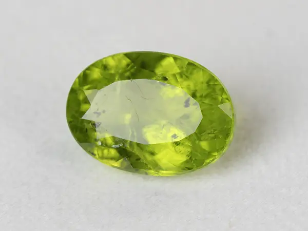 Peridot Stone 9.35 Carat (10.27 Ratti) 1 Peridot Stone 9.35 Carat (10.27 Ratti) overhead in natural green Oval Mix Cut