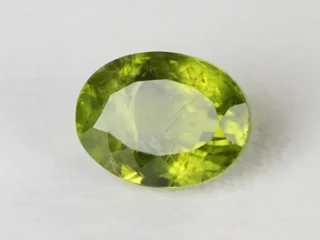 Peridot Stone 9.73 Carat (10.69 Ratti) top view in natural green Oval Mix Cut