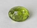 Peridot Stone 9.98 Carat (10.97 Ratti) back view with pavilion facets and symmetry