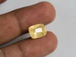 Ceylon Yellow Sapphire 9.48 ct (10.42 Ratti) in hand for true scale and tone