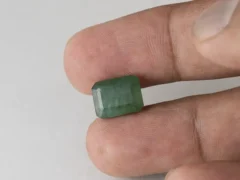 Zambian Emerald 5.75 Carat (6.32 Ratti) Panna Stone in hand for true scale and color